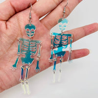 Mio Queena - Light Reflecting Skeleton Skull Dangle Earrings