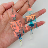 Mio Queena - Light Reflecting Skeleton Skull Dangle Earrings