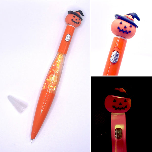 Orange pen with floating glitter inside and a cute jack o'lantern with a witch hat topper that lights up with a switch. 